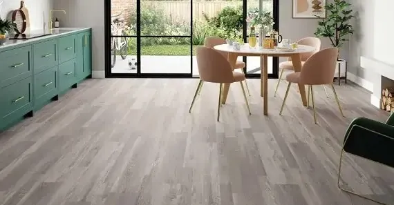 A modern dining area featuring light gray flooring