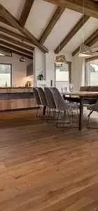 Bright, airy kitchen and dining area with wooden beams