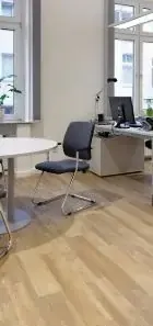 modern office interior featuring a sleek desk, computer setup